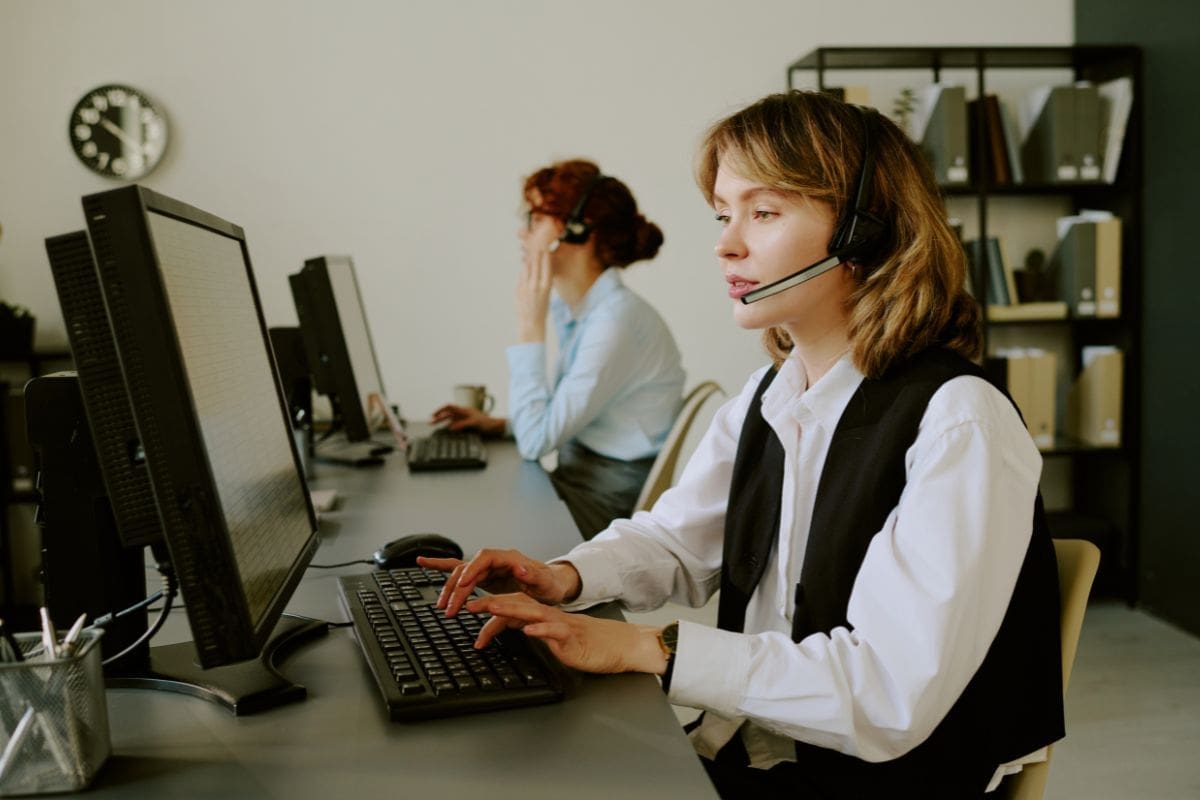 A lady Customer Support is busy entertaining a client