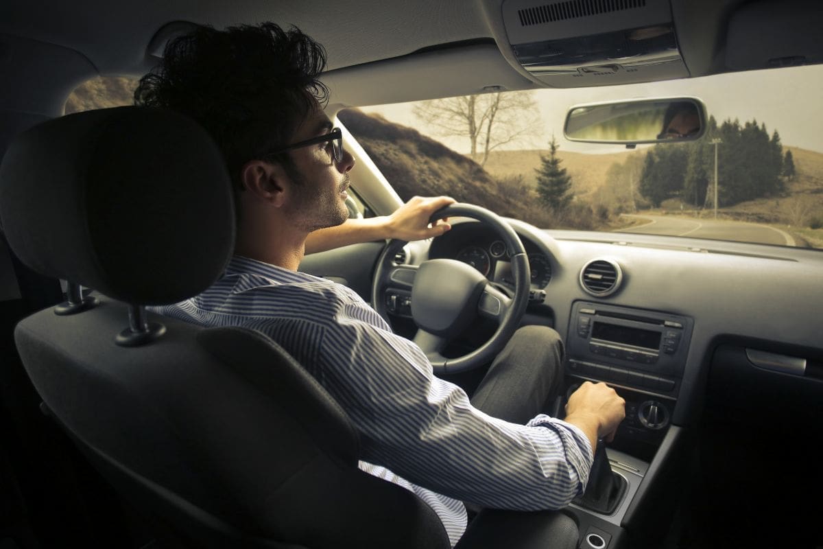 Showcasing a driver is focusing on the road while driving aiming for a safety manuever