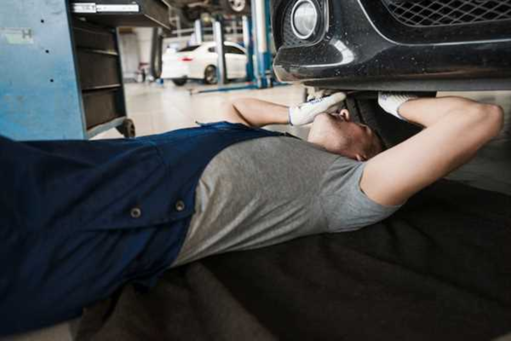 Auto Action Tech mechanic is installing car safety feature