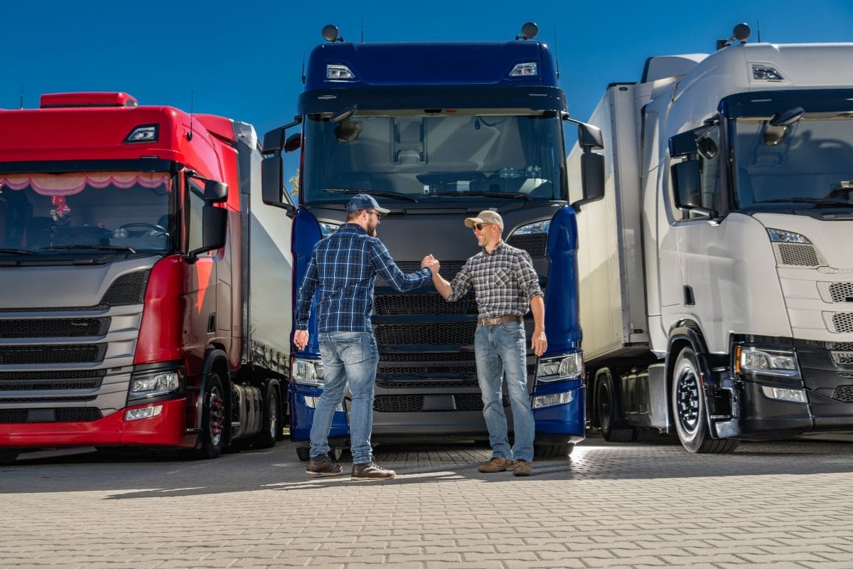 Two truck drivers meet and greet